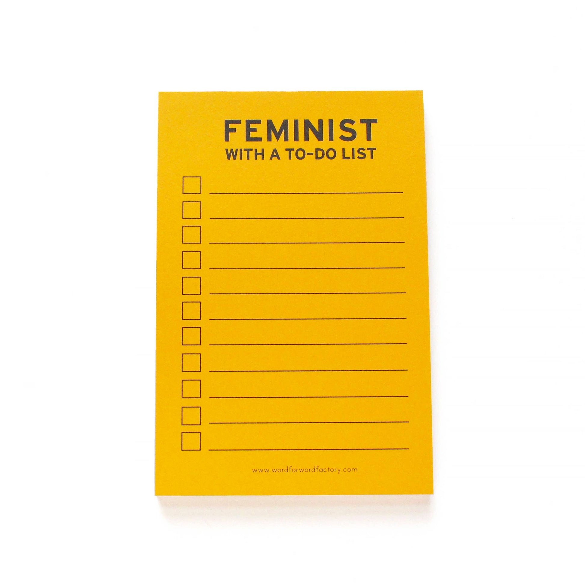 Yellow notepad with the header "feminist with a to-do list" and a blank checklist.