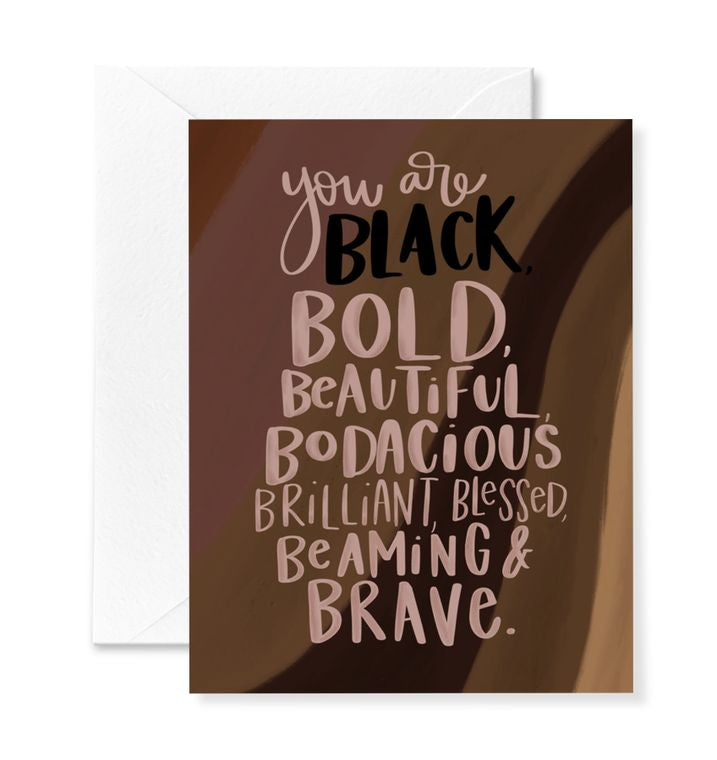 "You are black, bold, beautiful bodacious, brilliant, blessed, beaming & brave. Greeting card text on background of various shades of brown swooping stripes.